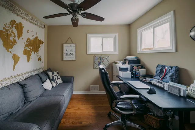 a workspace with furniture and window