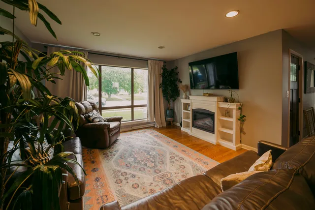 a bedroom with furniture and a flat screen tv