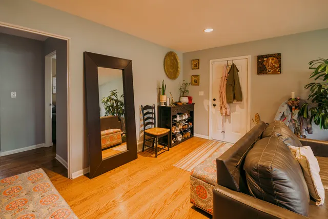 a bed room with a bed and a mirror