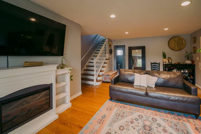 a living room with furniture and a fireplace