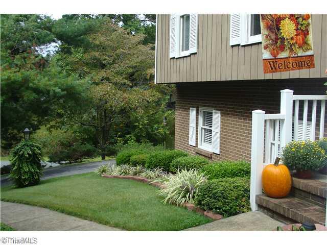240 Country Club Road Mount Airy, NC 27030 - Photo 5 of 16 Exterior Front. Side View of Manicured Lawn and Landscaping