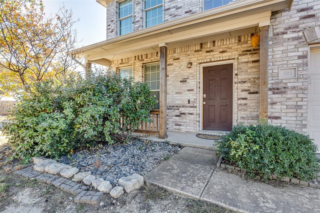 301 Turquoise Drive Fort Worth, TX 76131 - Photo 14 of 33 a front view of a building with plants