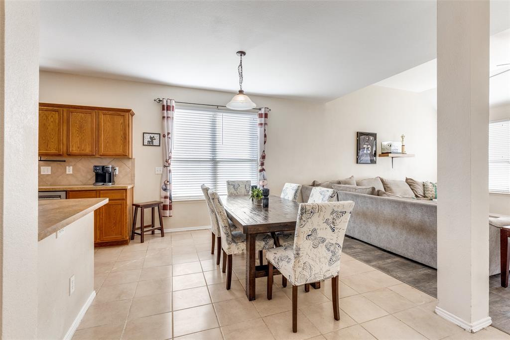 301 Turquoise Drive Fort Worth, TX 76131 - Photo 17 of 33 a view of a dining room with furniture and chandelier