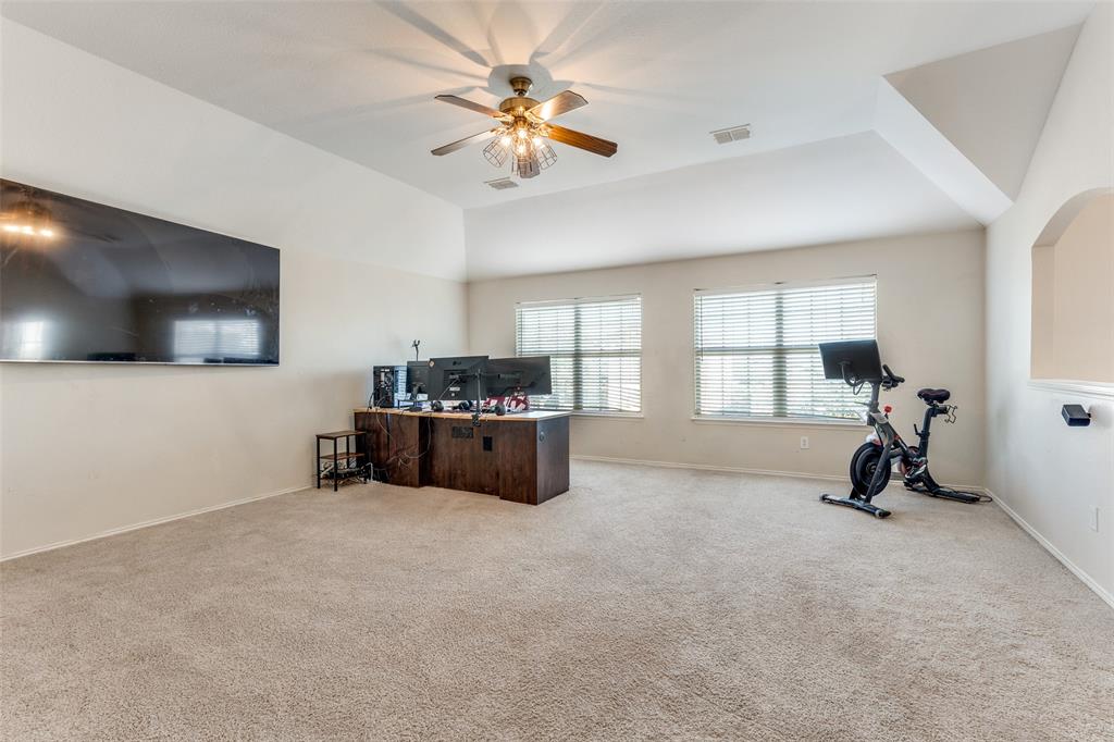 301 Turquoise Drive Fort Worth, TX 76131 - Photo 25 of 33 a room with furniture and a flat screen tv