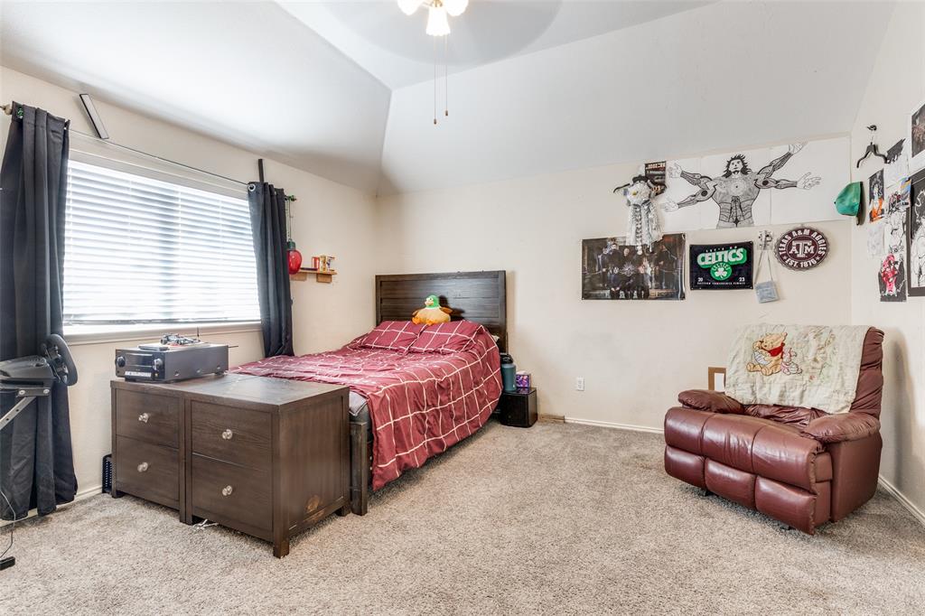 301 Turquoise Drive Fort Worth, TX 76131 - Photo 27 of 33 a bedroom with a bed and a couch