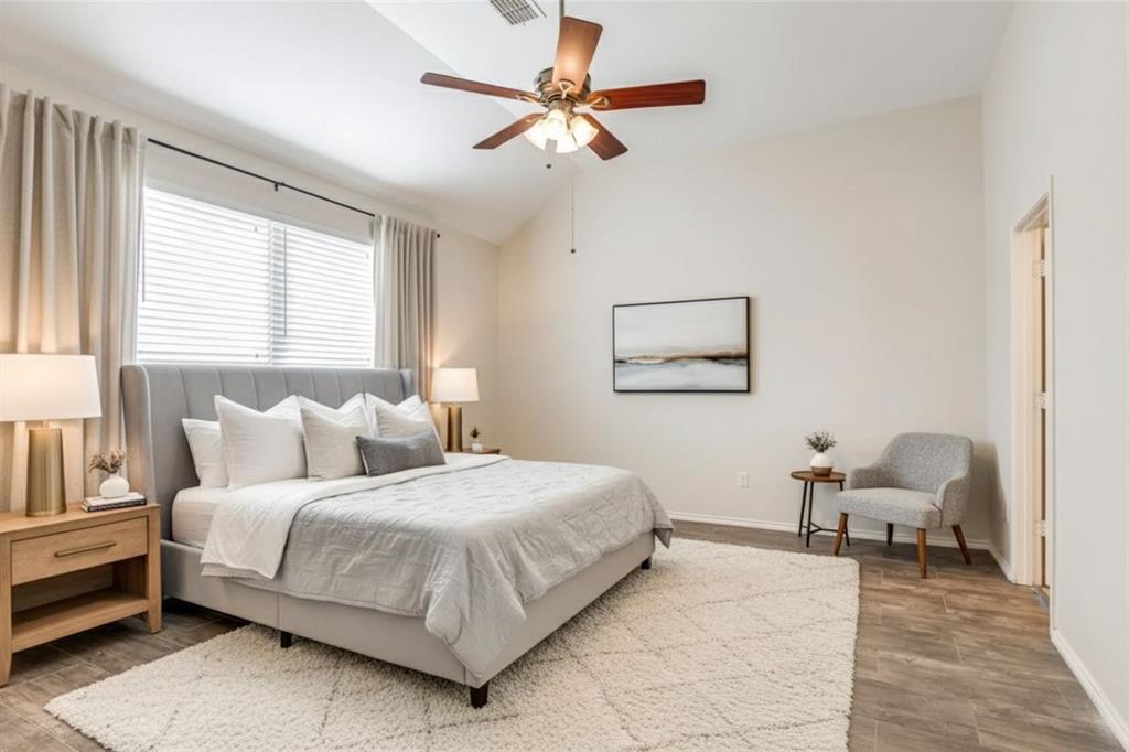 301 Turquoise Drive Fort Worth, TX 76131 - Photo 3 of 33 a bedroom with a bed a chandelier and a couch