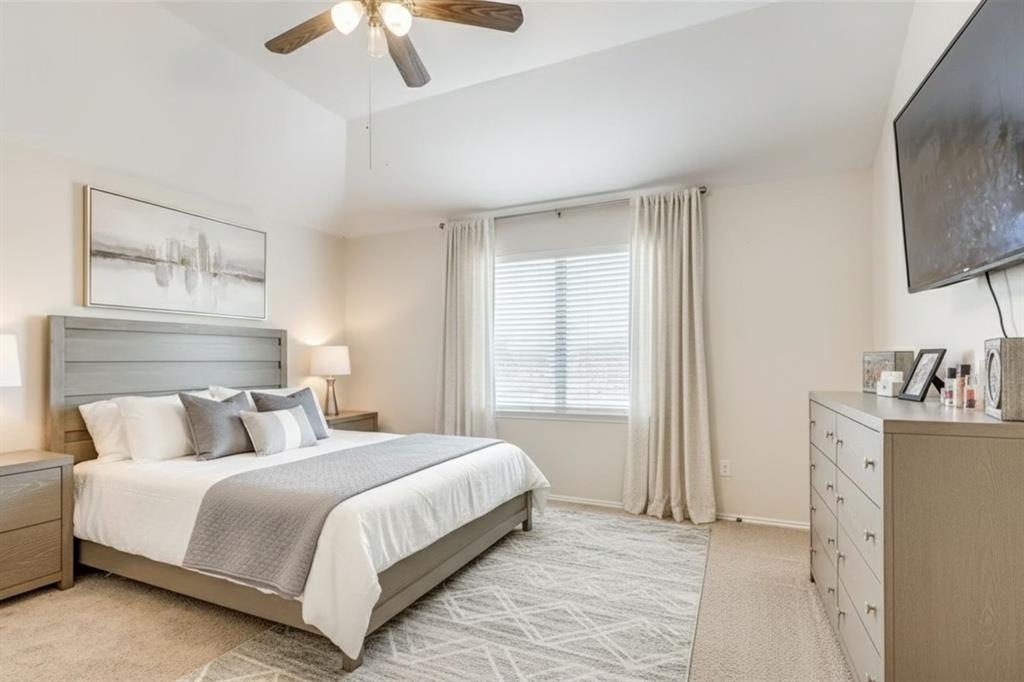 301 Turquoise Drive Fort Worth, TX 76131 - Photo 5 of 33 a bedroom with a bed and a chandelier