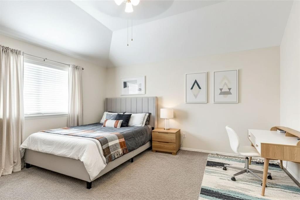 301 Turquoise Drive Fort Worth, TX 76131 - Photo 7 of 33 a bedroom with a bed a table and chair