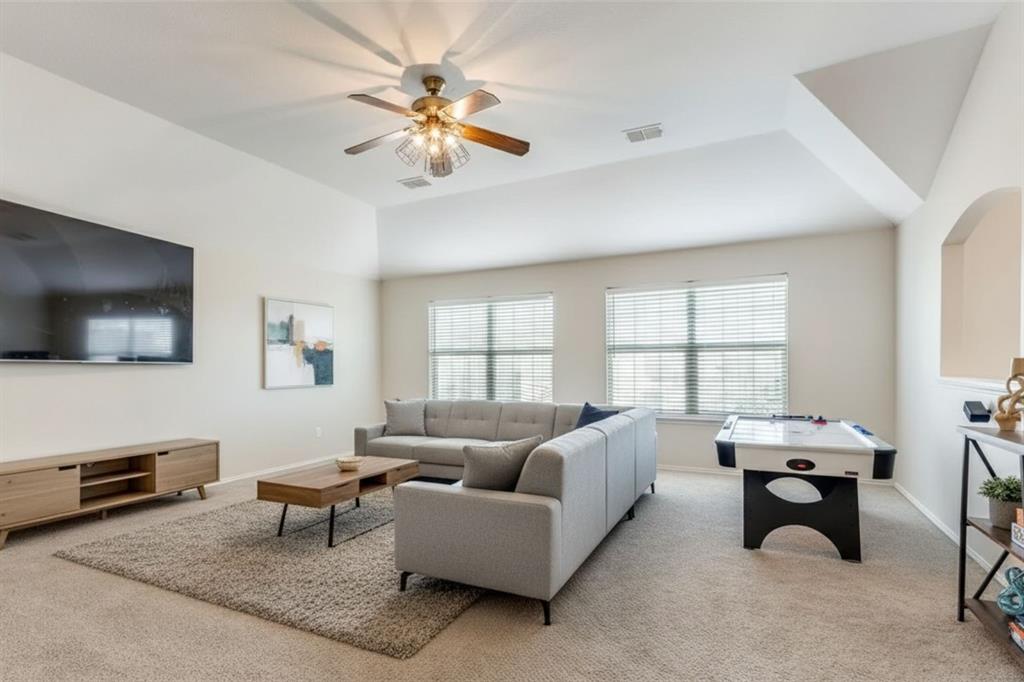 301 Turquoise Drive Fort Worth, TX 76131 - Photo 9 of 33 a living room with furniture and a flat screen tv