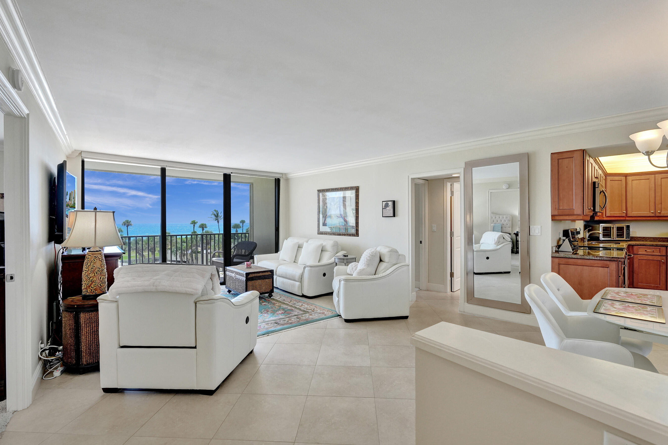 400 Ocean Trail Way, Unit 308 Jupiter, FL 33477 - Photo 11 of 65 a living room with furniture and a large window