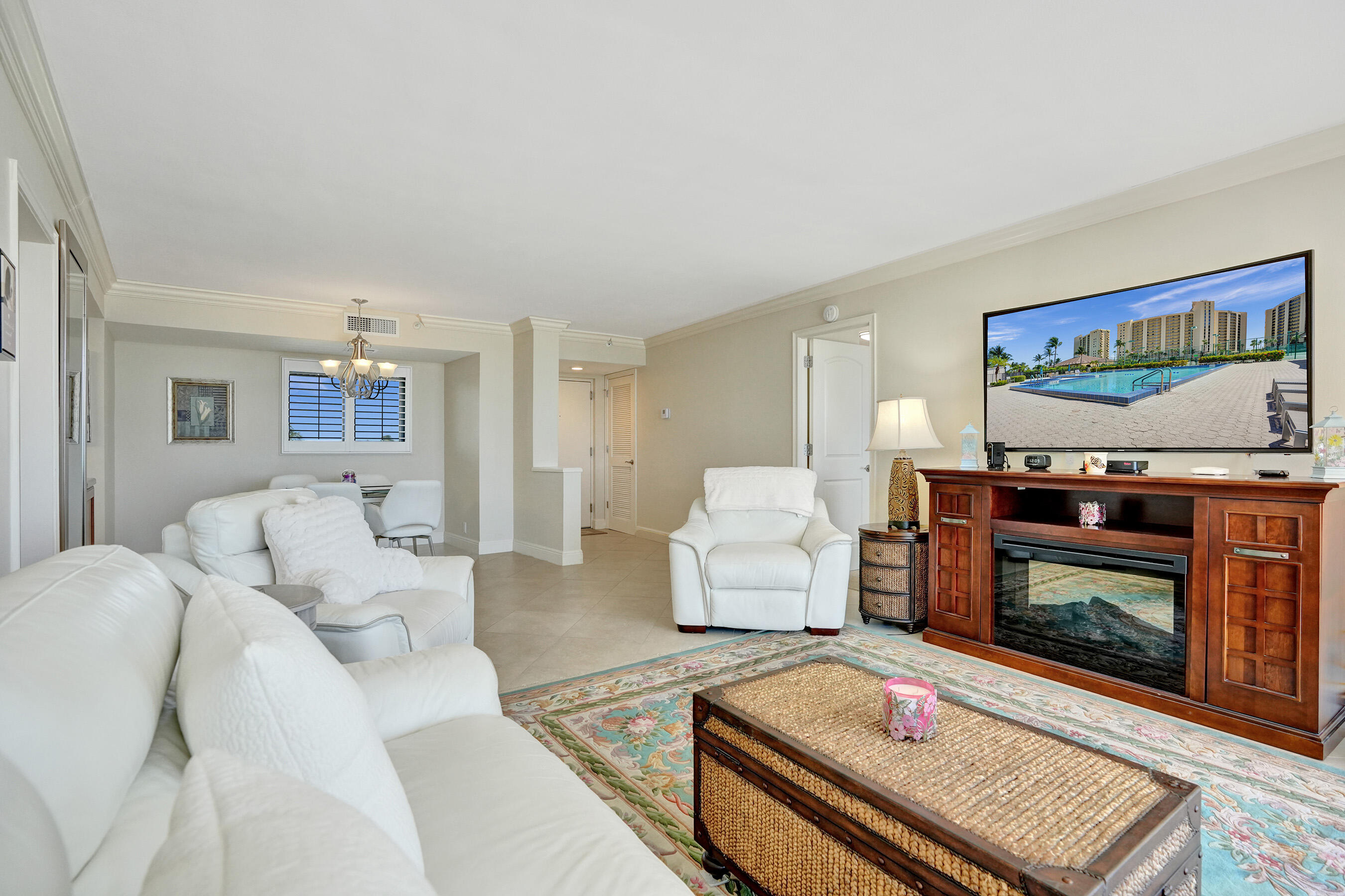400 Ocean Trail Way, Unit 308 Jupiter, FL 33477 - Photo 14 of 65 a living room with furniture and a fireplace