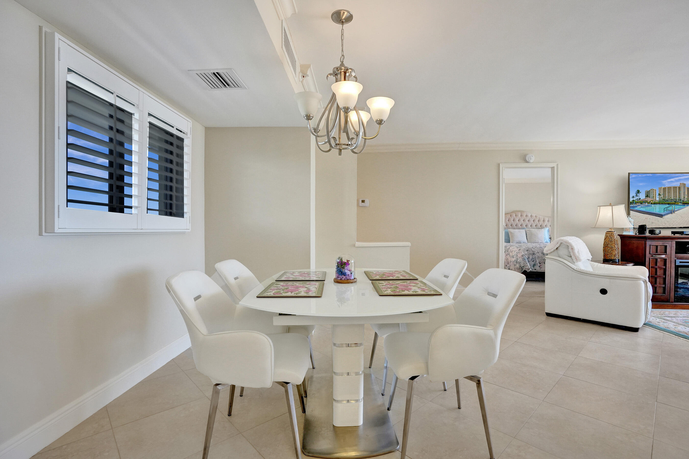 400 Ocean Trail Way, Unit 308 Jupiter, FL 33477 - Photo 16 of 65 a view of a dining room with furniture and wooden floor