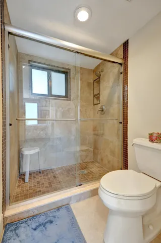 a green field with some trees in front of it