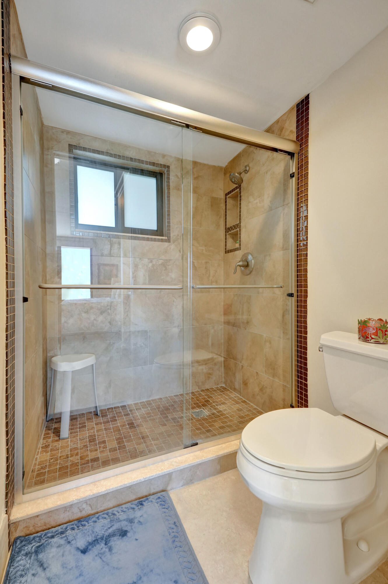 400 Ocean Trail Way, Unit 308 Jupiter, FL 33477 - Photo 32 of 65 a bathroom with a toilet and a shower