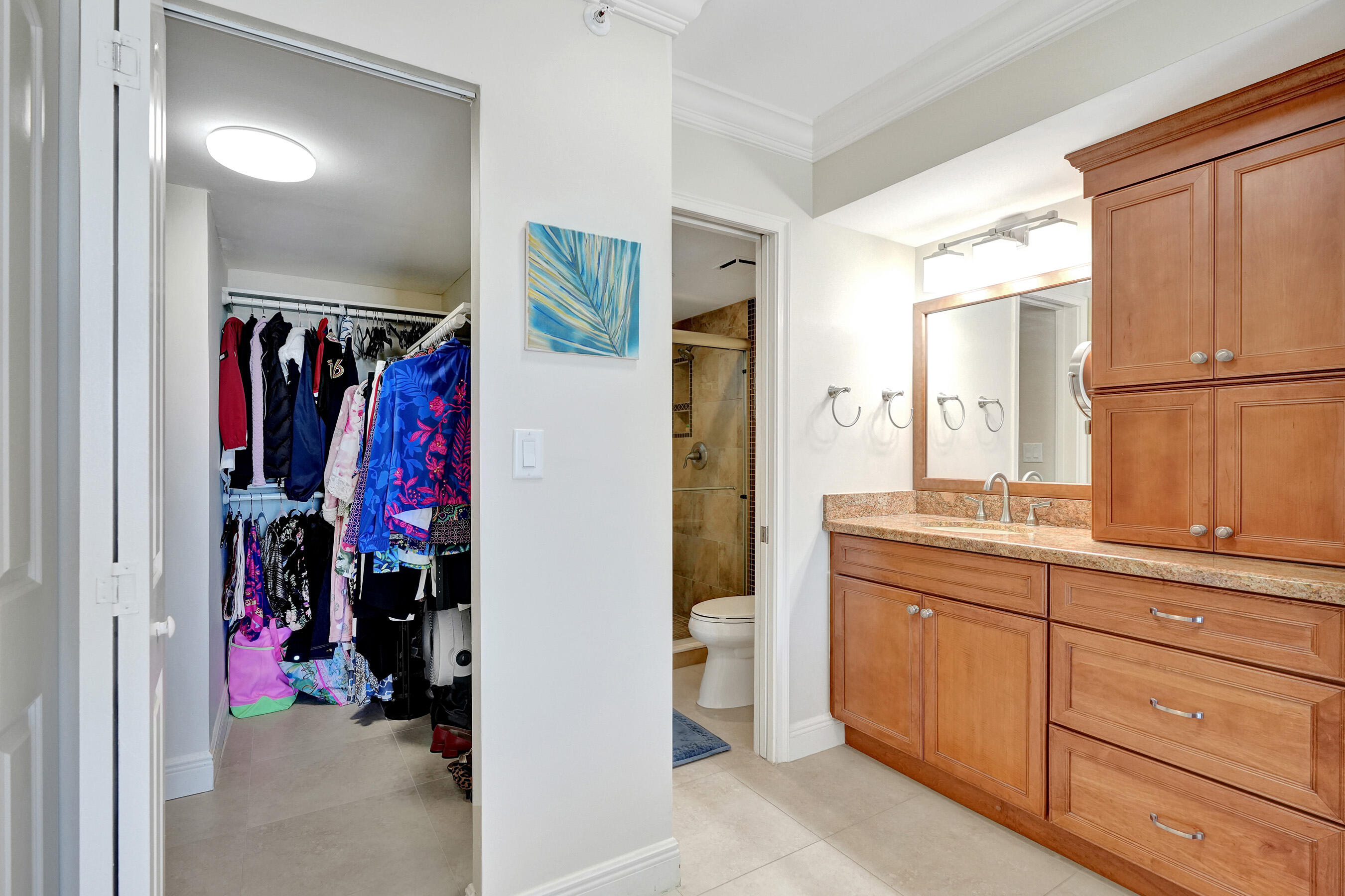 400 Ocean Trail Way, Unit 308 Jupiter, FL 33477 - Photo 33 of 65 a view of walk in closet with clothes and shoes