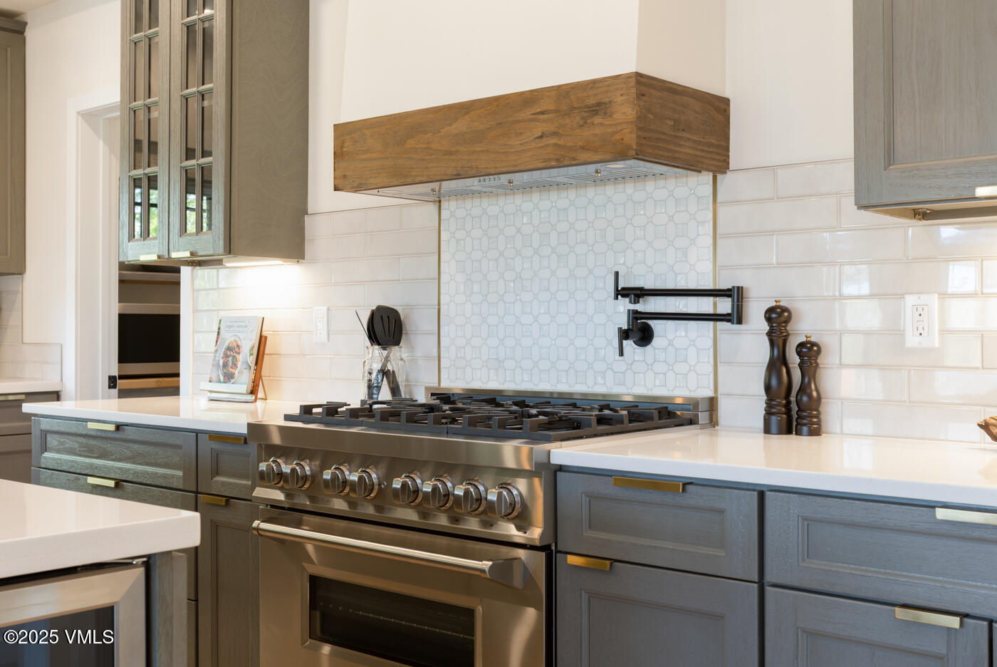 207 Aidan Road Eagle, CO 81631 - Photo 11 of 51 a kitchen with a stove and a sink