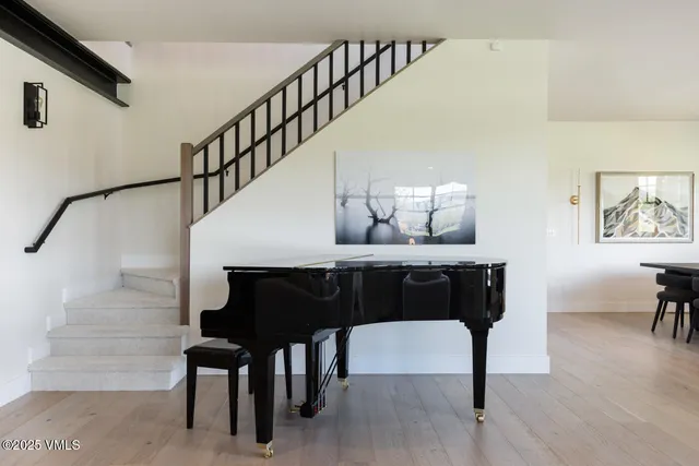 a front view of a house with garden and porch