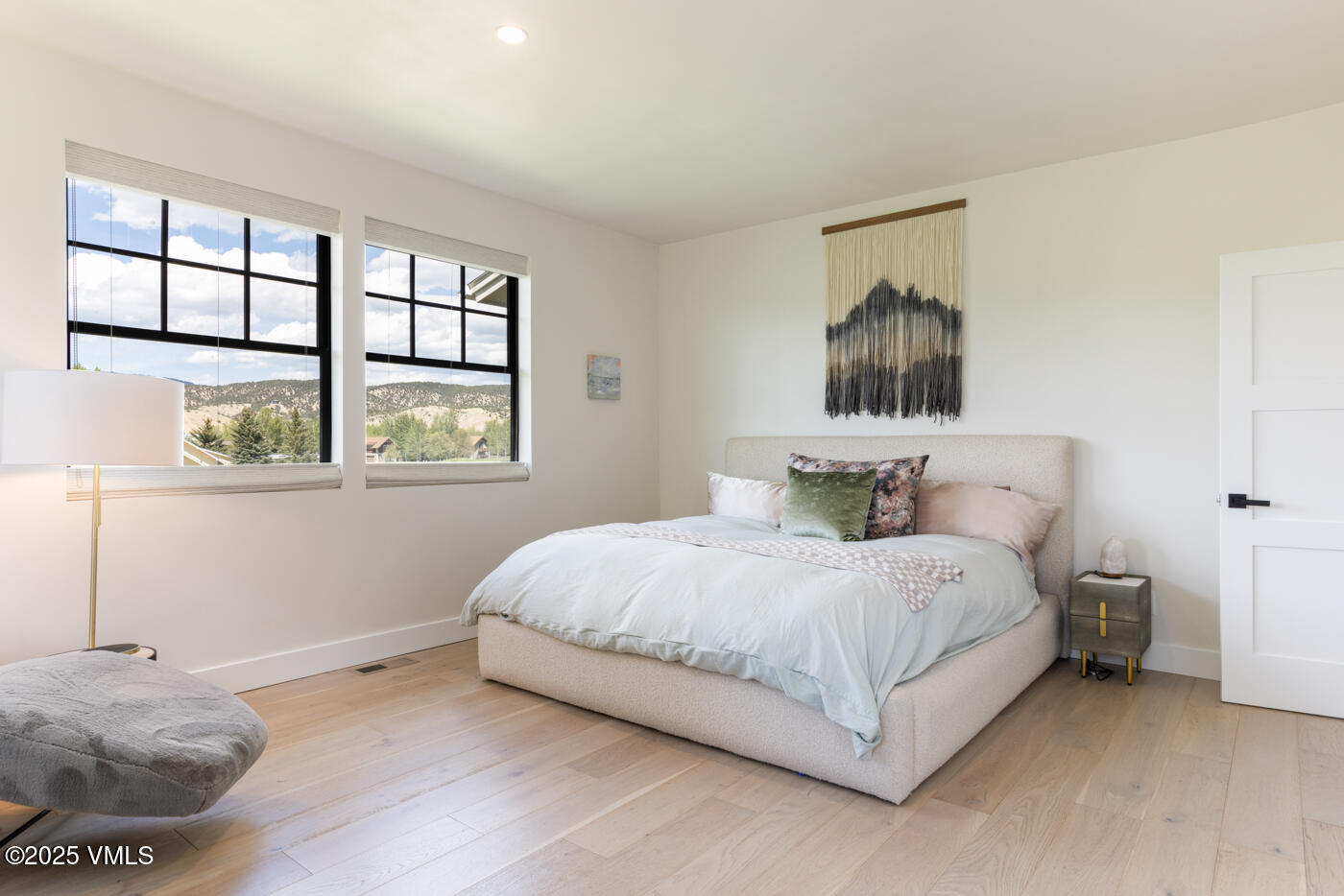 207 Aidan Road Eagle, CO 81631 - Photo 23 of 51 a bedroom with a bed and a window