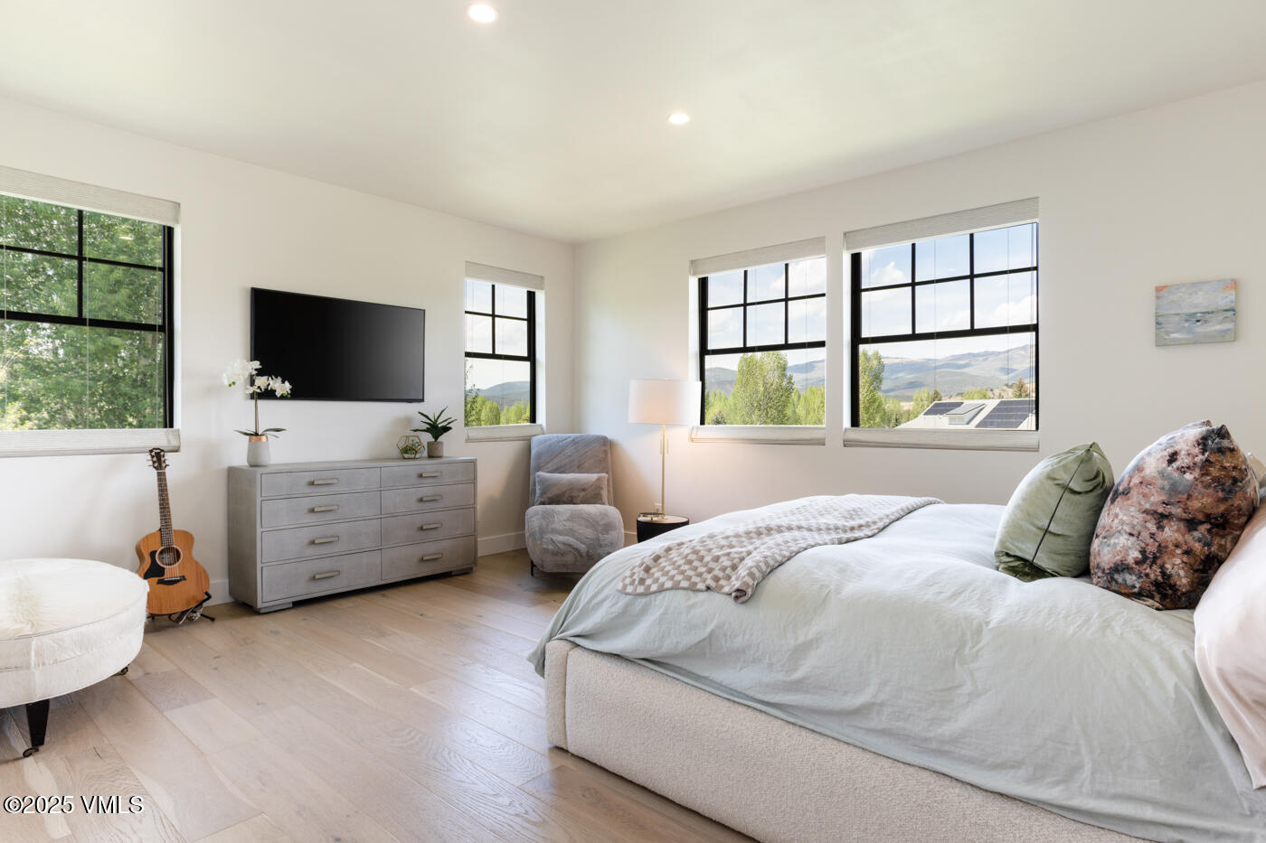 207 Aidan Road Eagle, CO 81631 - Photo 24 of 51 a bedroom with a bed and large flat screen tv