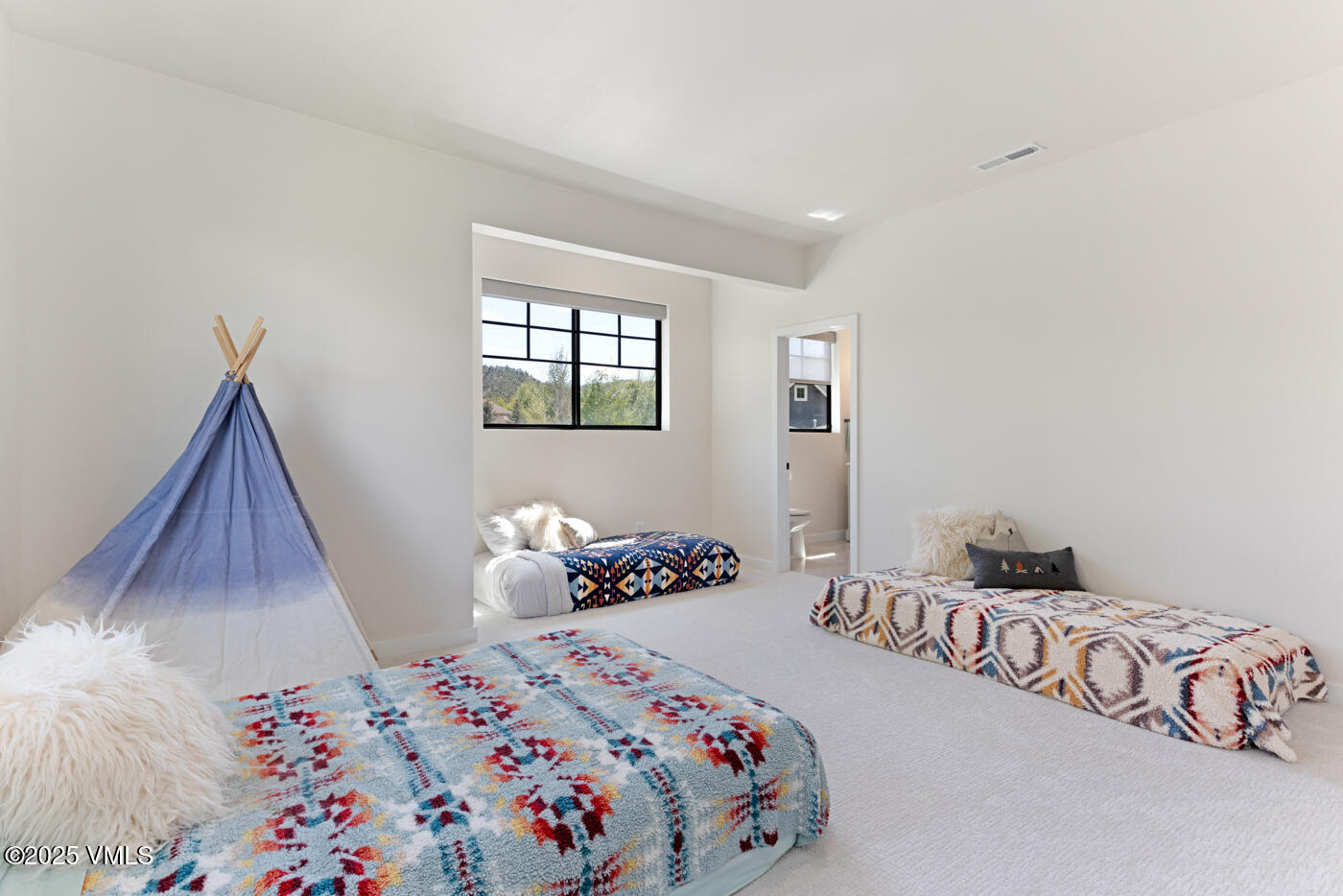 207 Aidan Road Eagle, CO 81631 - Photo 30 of 51 a bedroom with a bed and a window