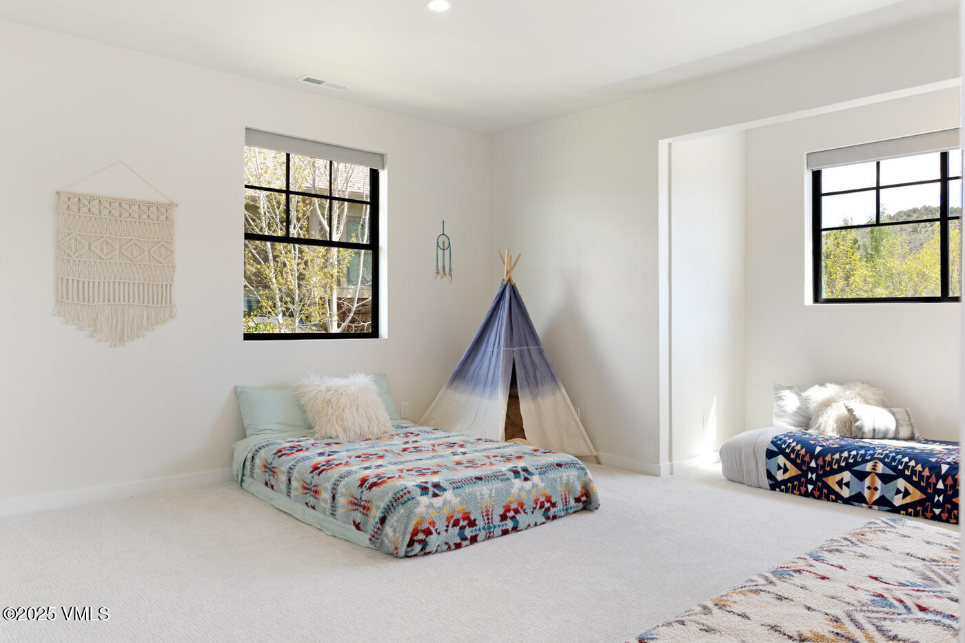 207 Aidan Road Eagle, CO 81631 - Photo 31 of 51 a bedroom with a bed and window