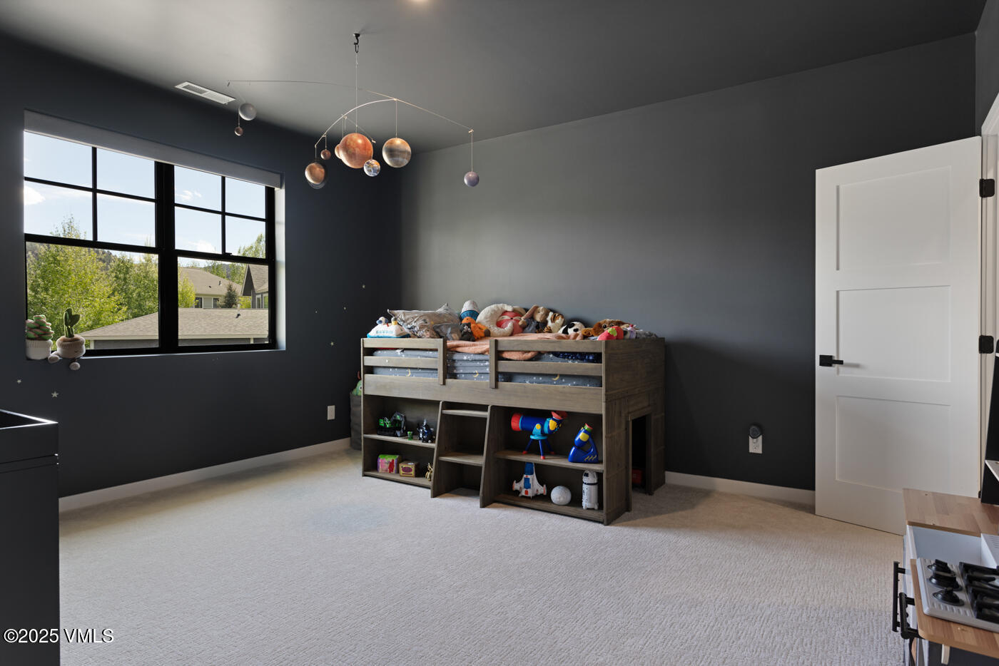 207 Aidan Road Eagle, CO 81631 - Photo 36 of 51 a bedroom with bed and a window