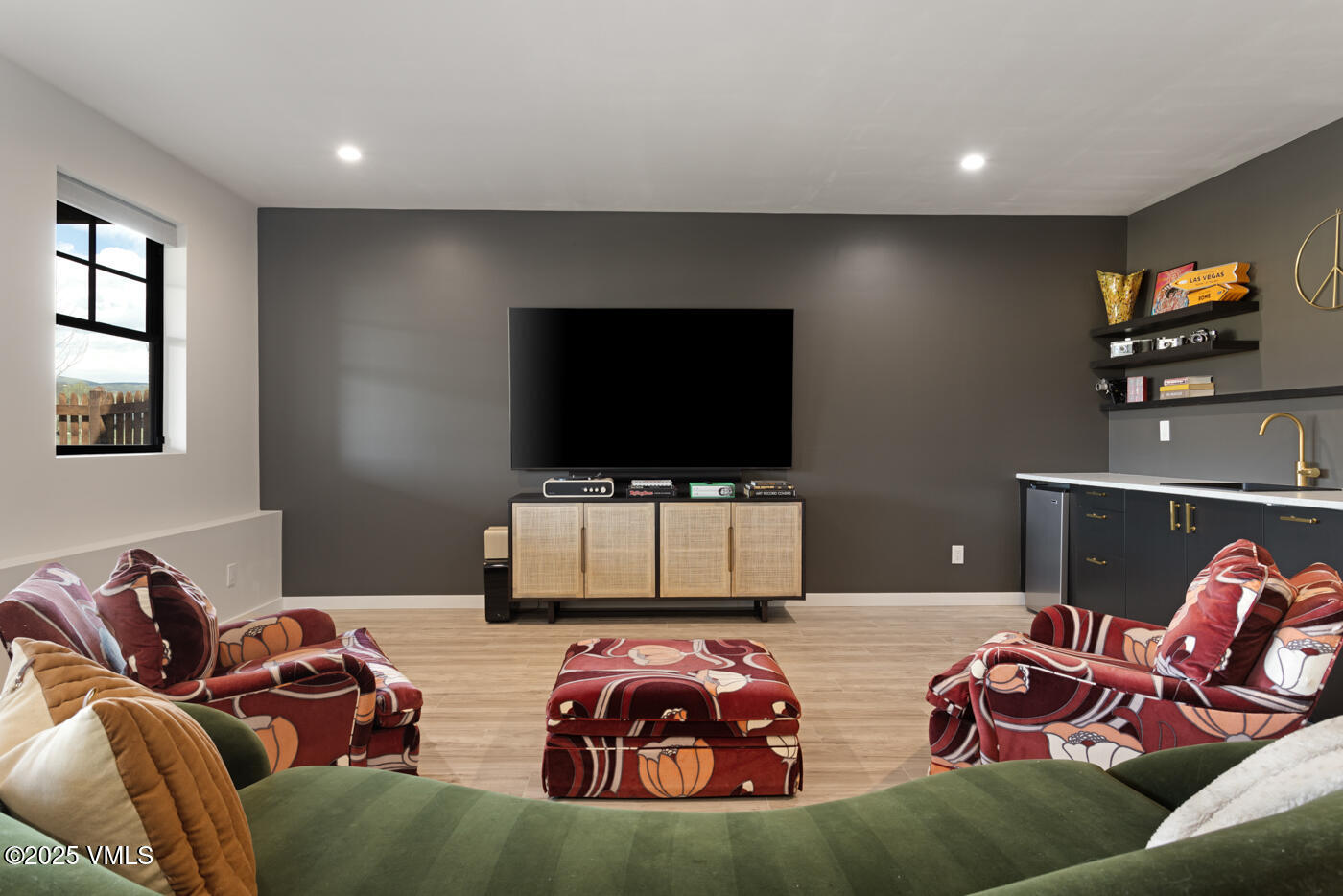 207 Aidan Road Eagle, CO 81631 - Photo 38 of 51 a living room with furniture and a flat screen tv