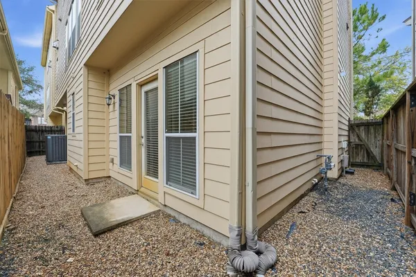 a view of a house with a door and wooden floor