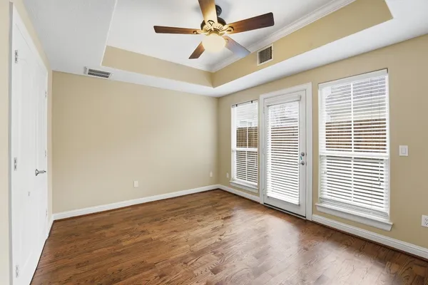 an empty room with a empty space and windows