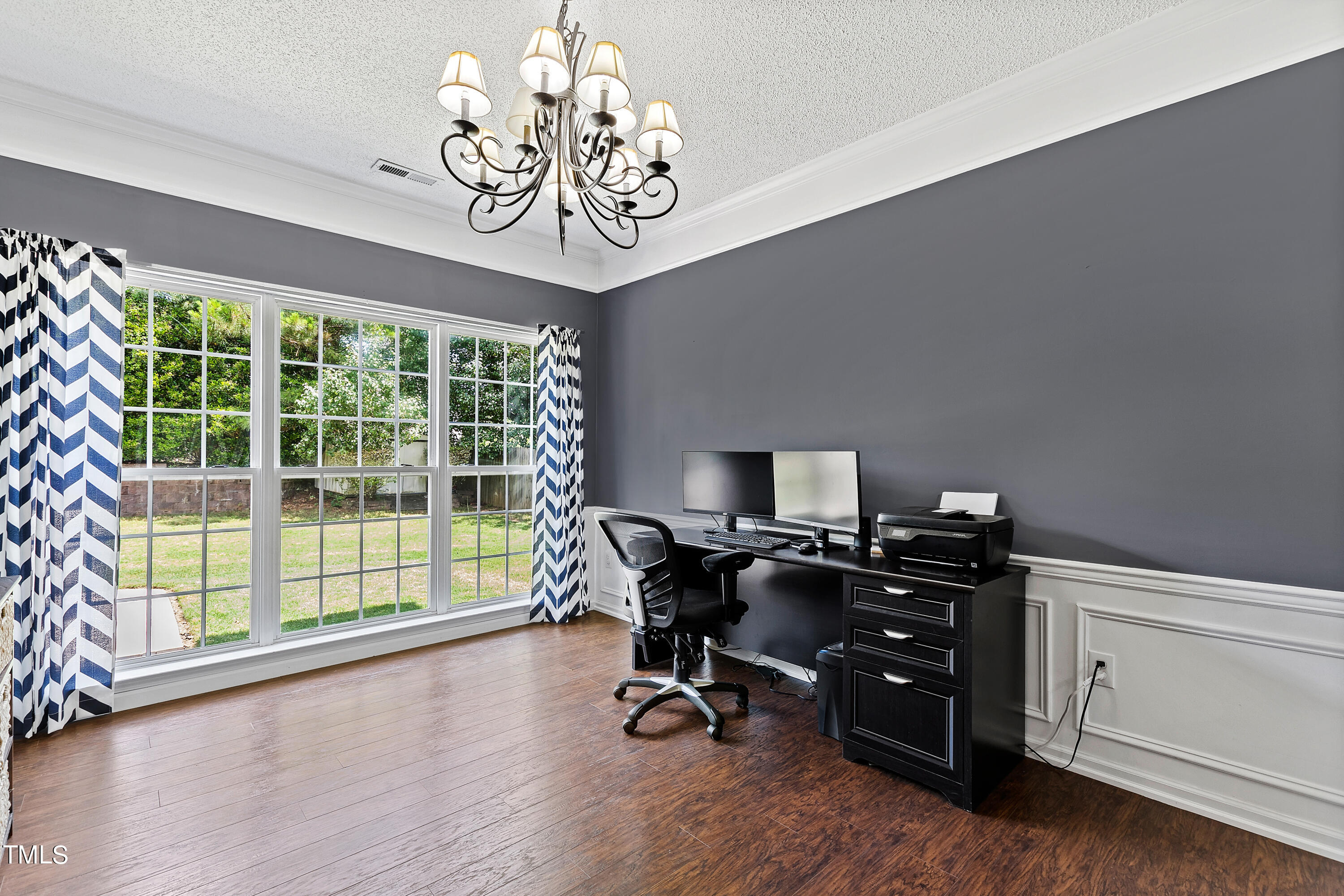 401 New Timber Path Apex, NC 27502 - Photo 17 of 38 a view of a workspace with furniture and a window