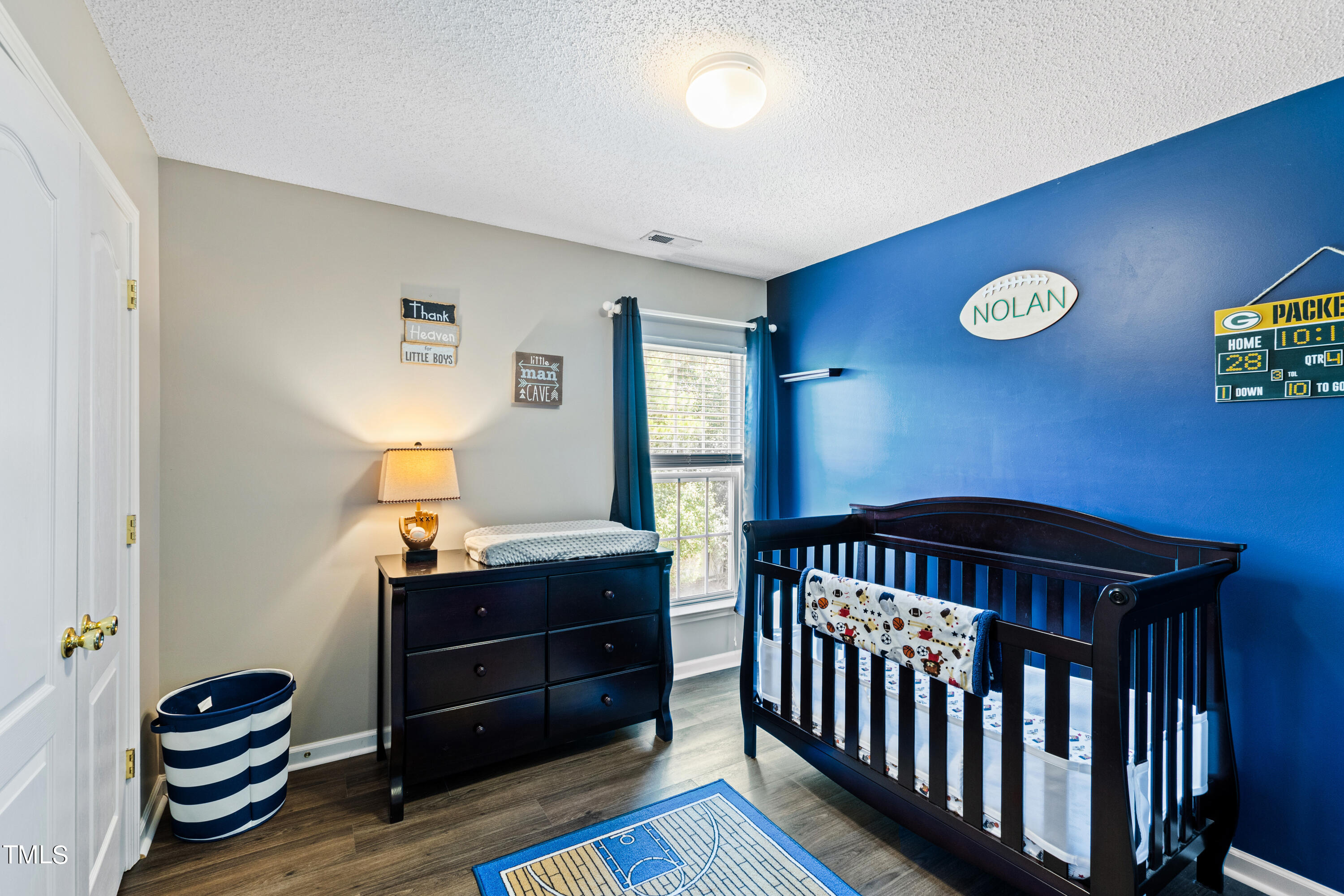 401 New Timber Path Apex, NC 27502 - Photo 31 of 38 a bedroom with a bed and a desk