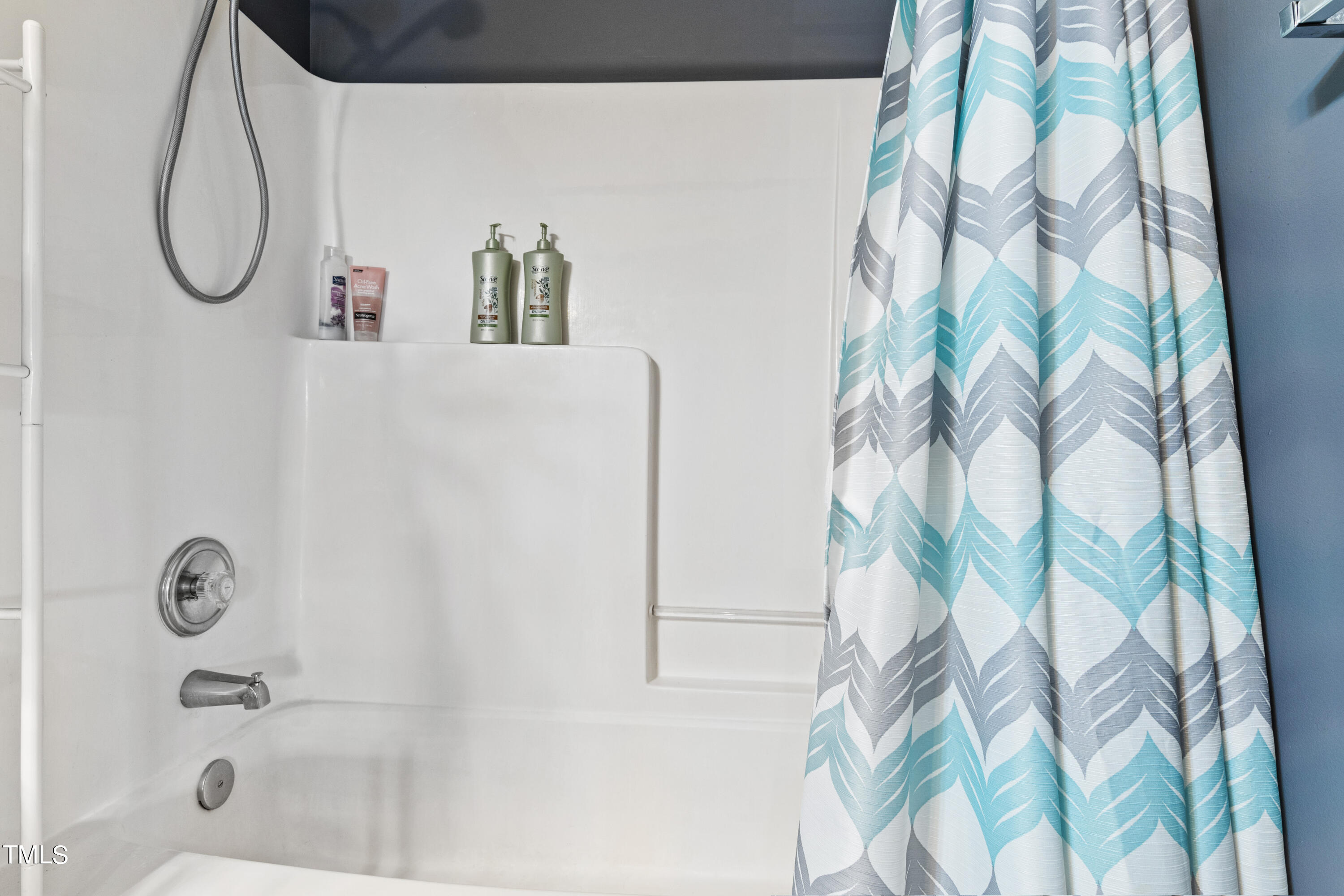 401 New Timber Path Apex, NC 27502 - Photo 33 of 38 a bathroom with a shower