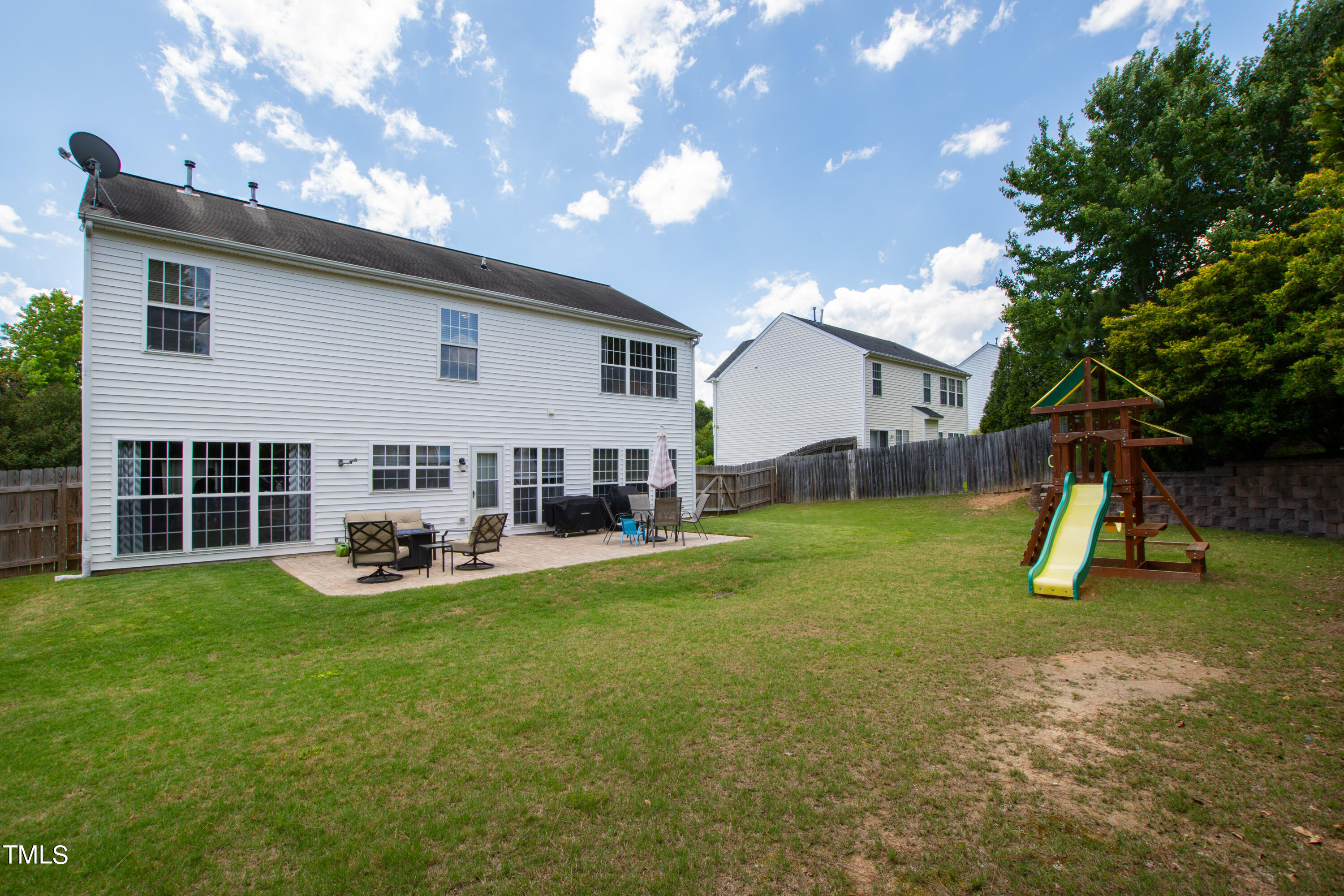 401 New Timber Path Apex, NC 27502 - Photo 36 of 38 a view of a house with backyard porch and sitting area