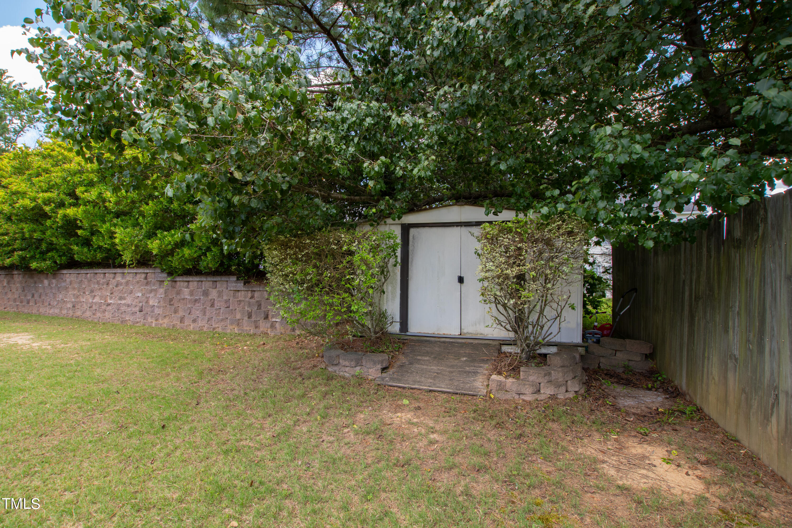 401 New Timber Path Apex, NC 27502 - Photo 37 of 38 a view of a backyard