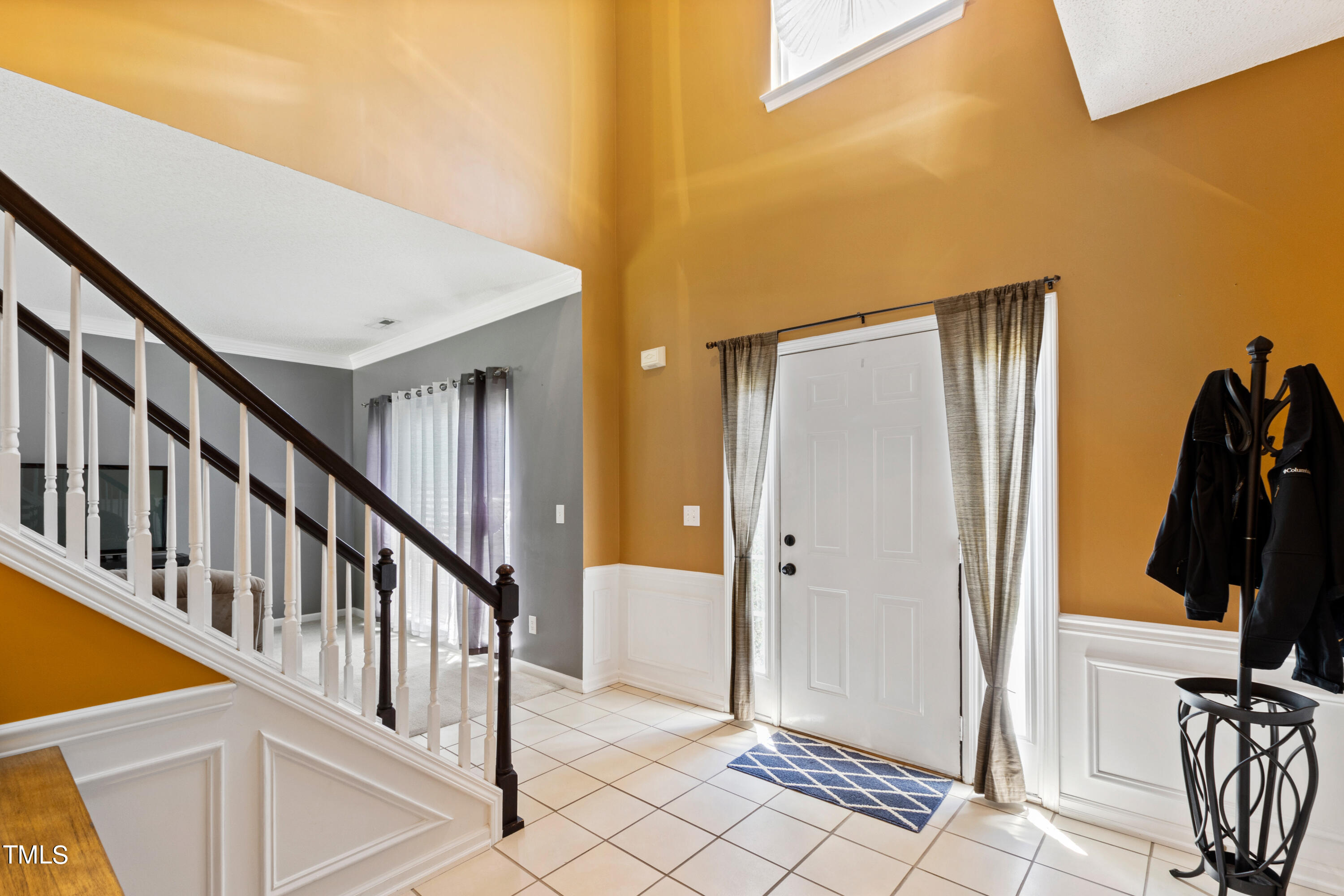 401 New Timber Path Apex, NC 27502 - Photo 5 of 38 a view of a hallway with closet and black white walls