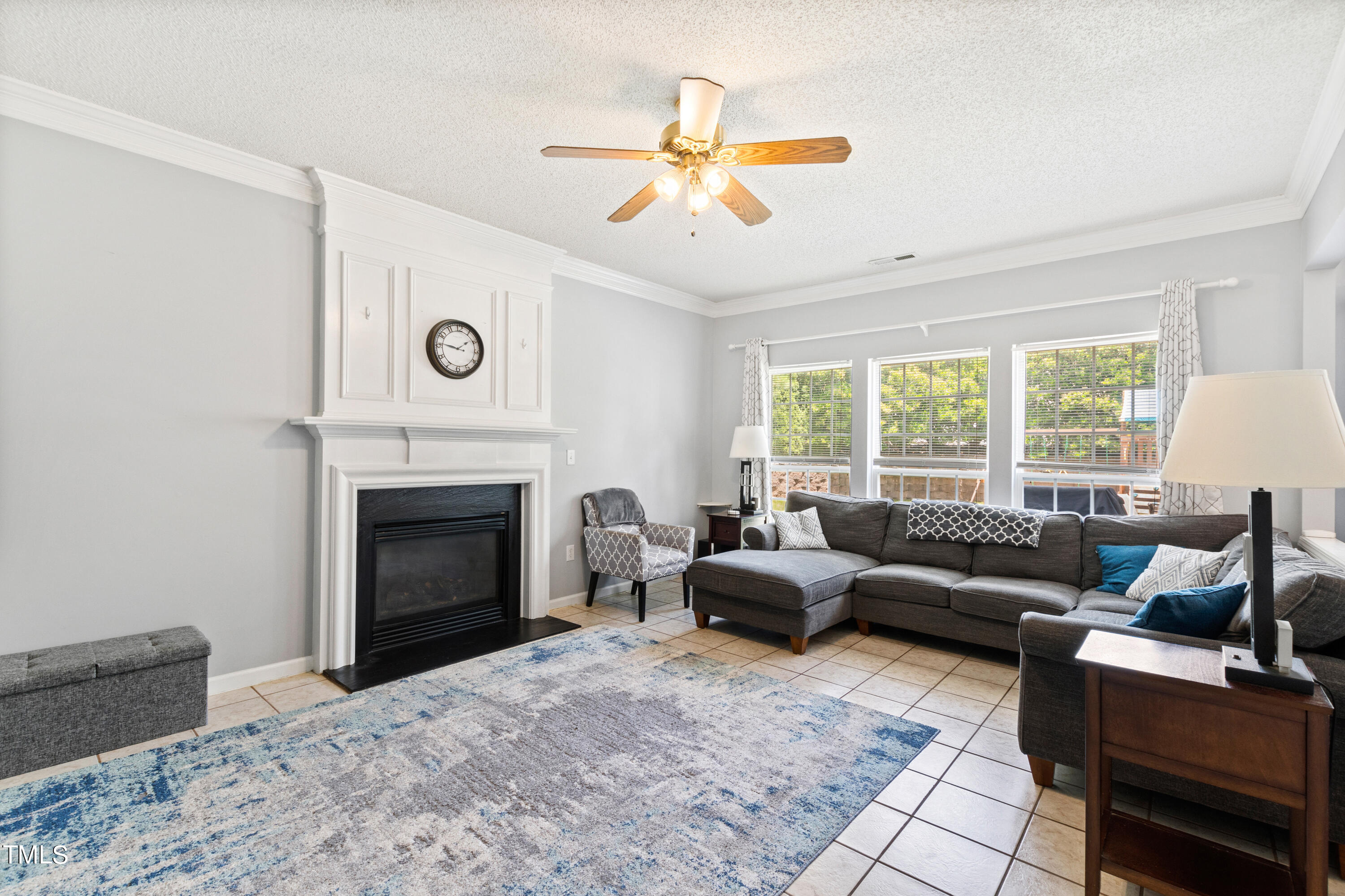 401 New Timber Path Apex, NC 27502 - Photo 7 of 38 a living room with furniture and a fireplace