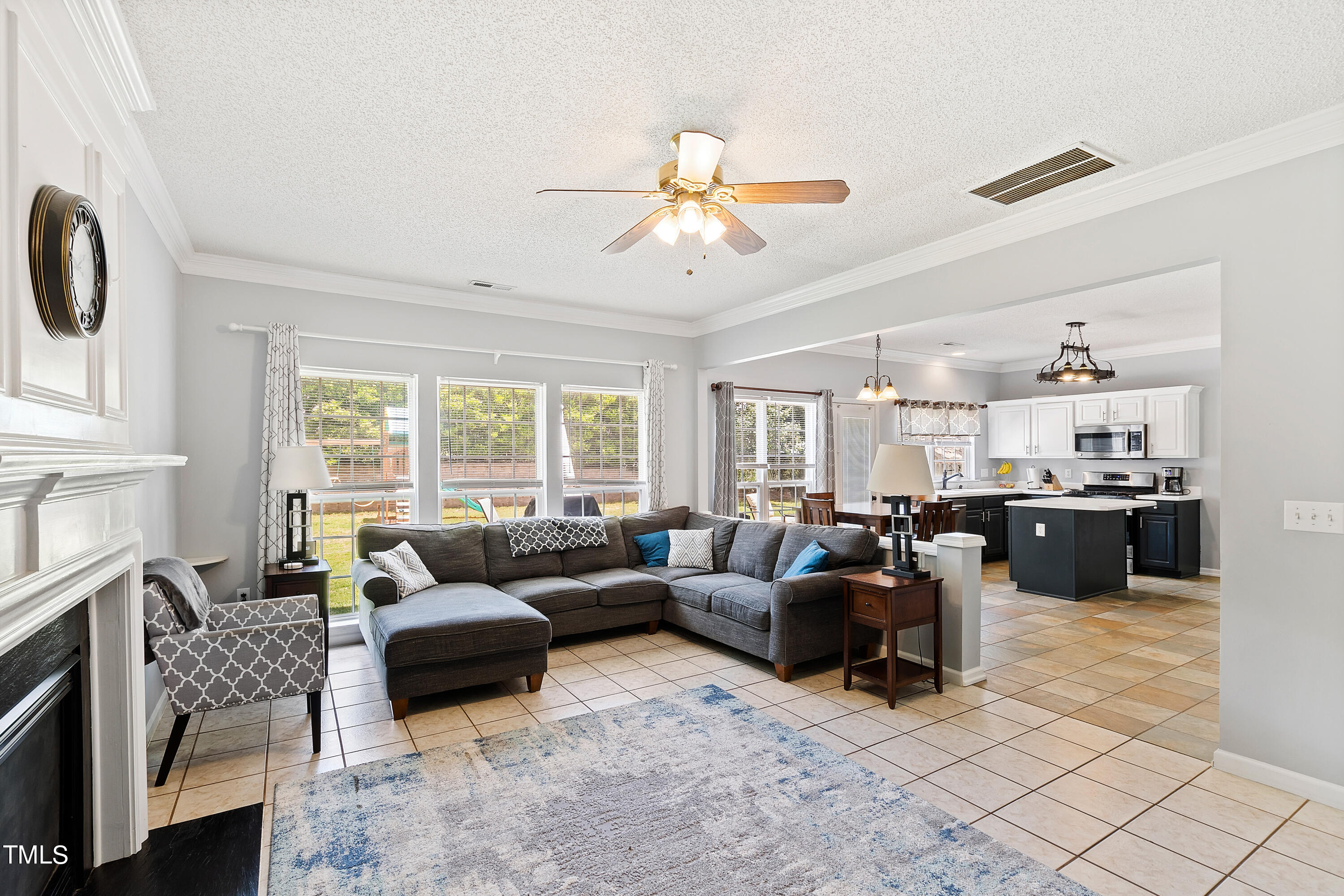 401 New Timber Path Apex, NC 27502 - Photo 8 of 38 a living room with furniture and a large window