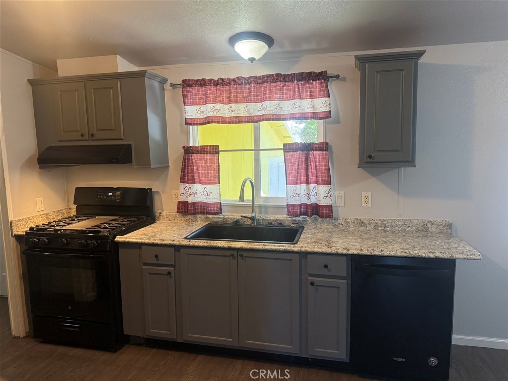 6845 Floyd Way Nice, CA 95464 - Photo 21 of 59 a kitchen with stainless steel appliances granite countertop a sink stove and cabinets