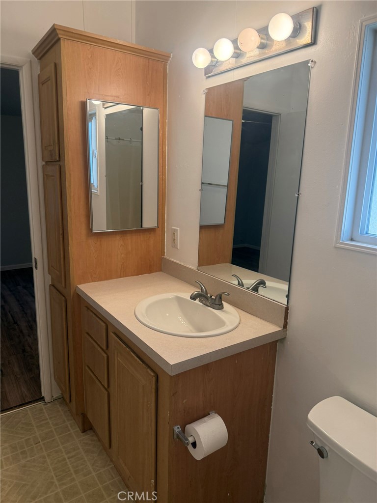 6845 Floyd Way Nice, CA 95464 - Photo 25 of 59 a bathroom with a sink and a mirror