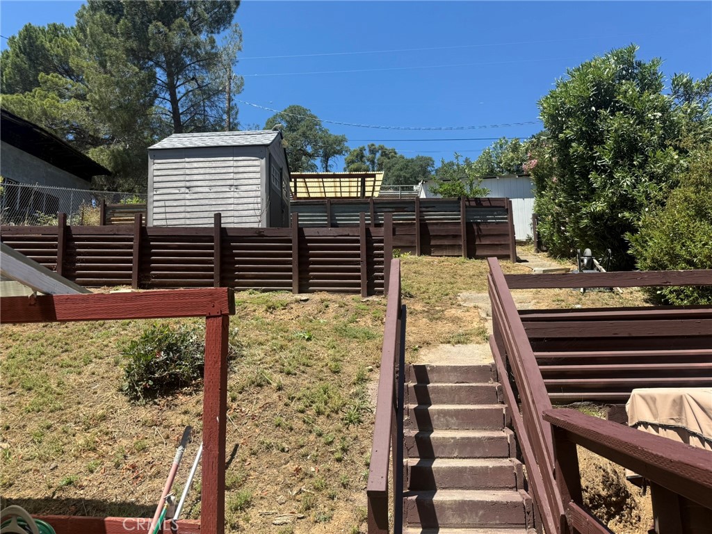 6845 Floyd Way Nice, CA 95464 - Photo 4 of 59 a view of a balcony with wooden floor and fence