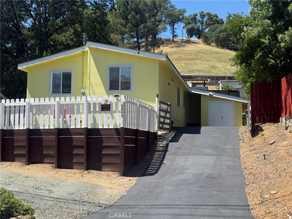 6845 Floyd Way Nice, CA 95464 - Photo 57 of 59 a view of a house with wooden fence