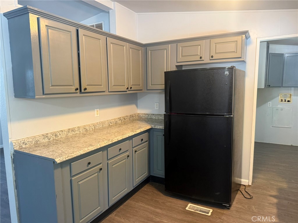 6845 Floyd Way Nice, CA 95464 - Photo 7 of 59 a kitchen with refrigerator cabinets and wooden floor