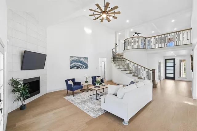a living room with furniture fireplace and a flat screen tv