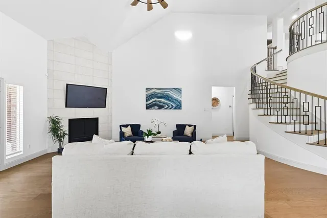 a living room with furniture and a flat screen tv