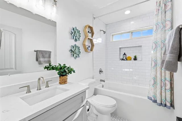 a view of a brick house with a large window