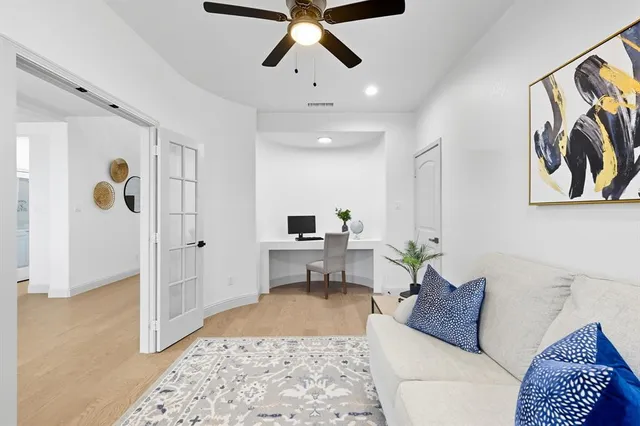 a living room with furniture and window