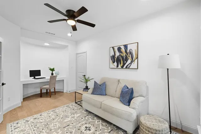 a living room with furniture and a rug