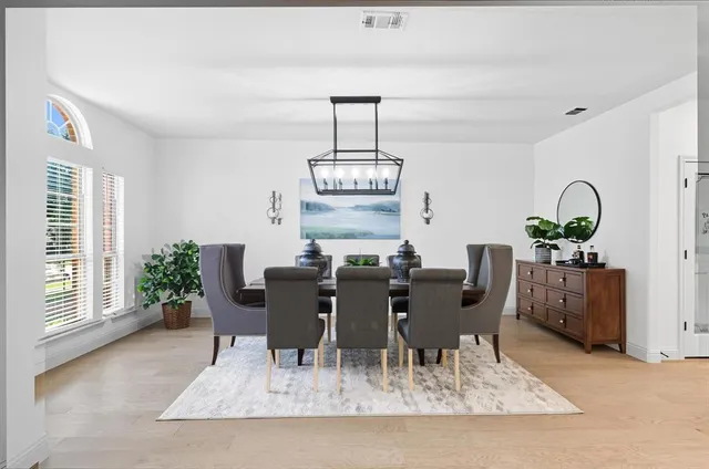 a view of a dining room with furniture window and outside view
