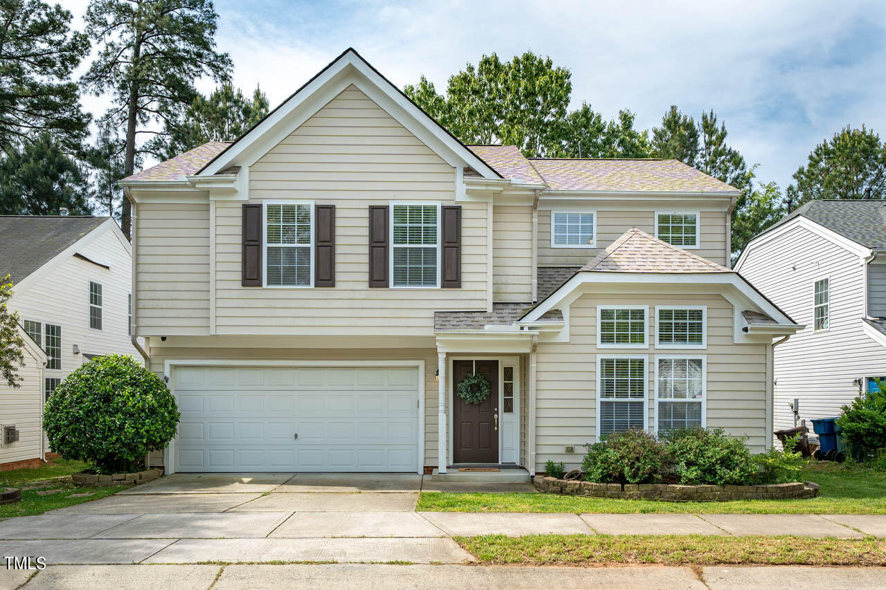 1314 Mallory Lane Durham, NC 27713 - Photo 1 of 47 a front view of a house with a yard and garage