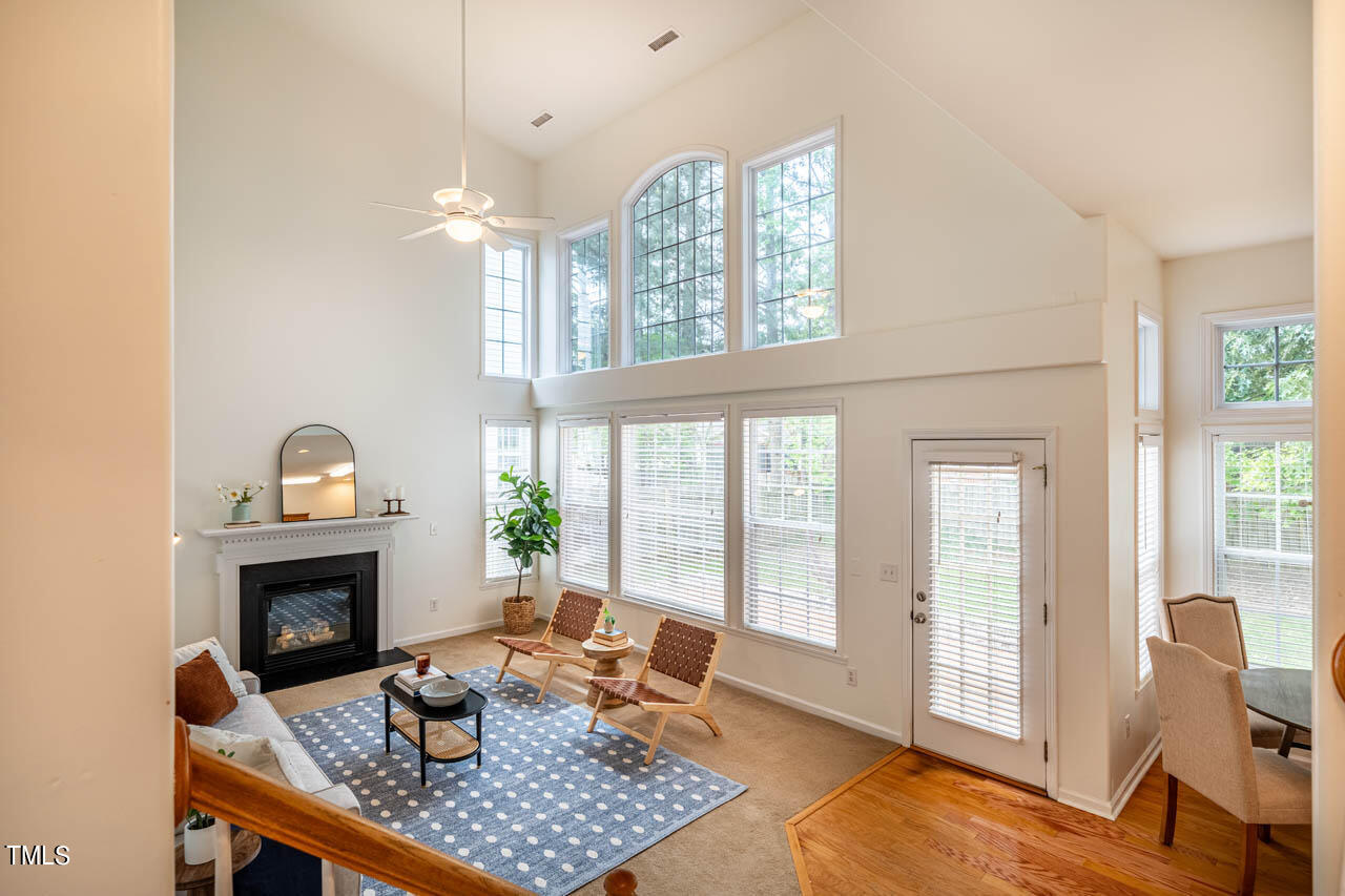 1314 Mallory Lane Durham, NC 27713 - Photo 12 of 47 a living room with furniture a fireplace and next to windows